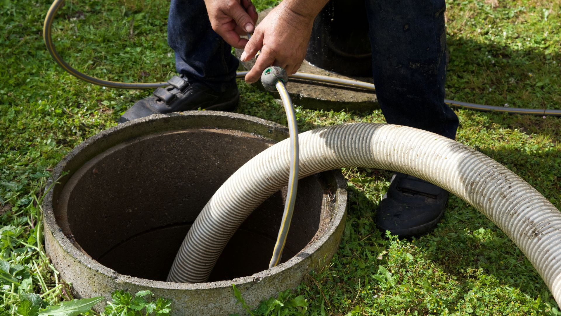 plumber-close-up-cleaning-sewer-tank-mayfaire-wilmington-nc
